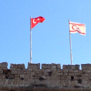 Flags from the Turkish Republic next to that of Northern Cyprus in Kyrenia's castle - two peas in a pod? (Image by Liz Cameron)